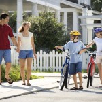 What Charlotte Neighborhood Is Right For Me? Family Walking with Bicycles