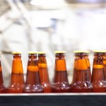 Sycamore Brewing Company Beer bottles on the conveyor belt